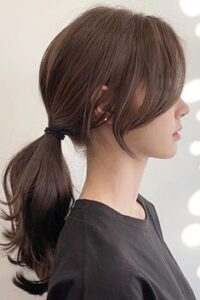 High Ponytail with Draped Curtain Bangs
